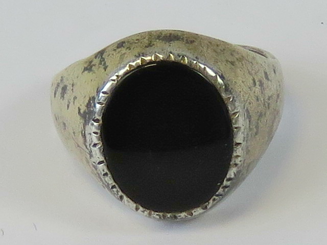 A silver and onyx signet ring, size k, stamped 925 silver.