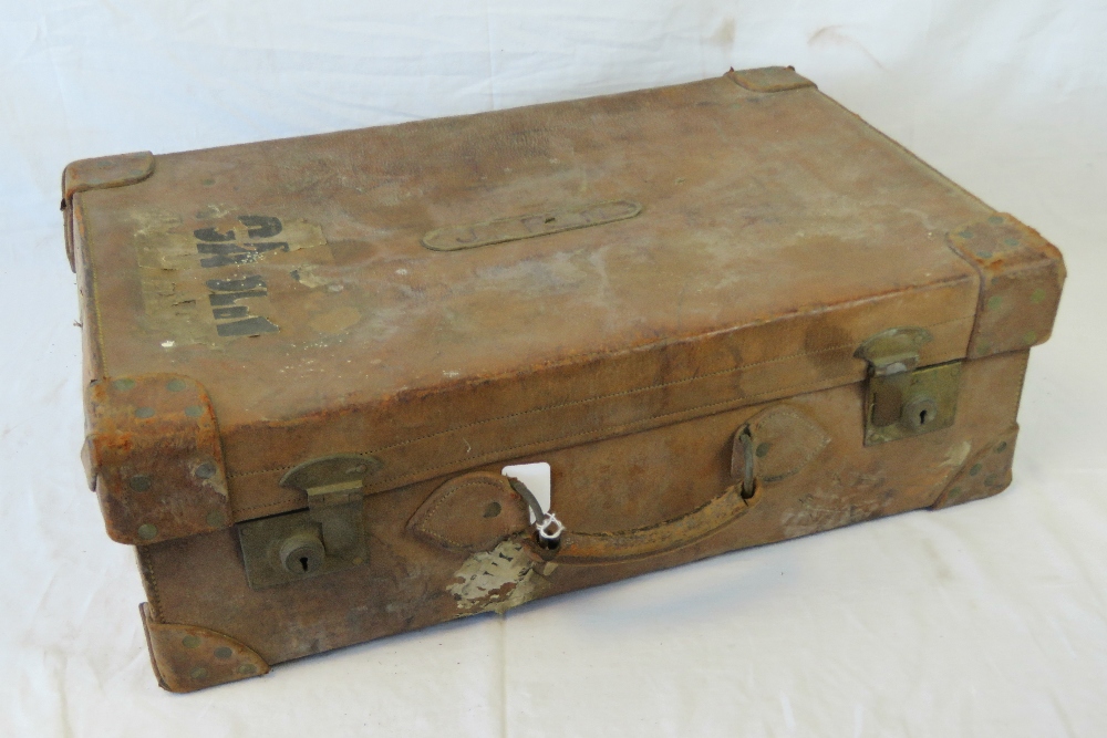 A vintage heavy leather travelling case with fitted interior, bears initials to the lid J.F.N.