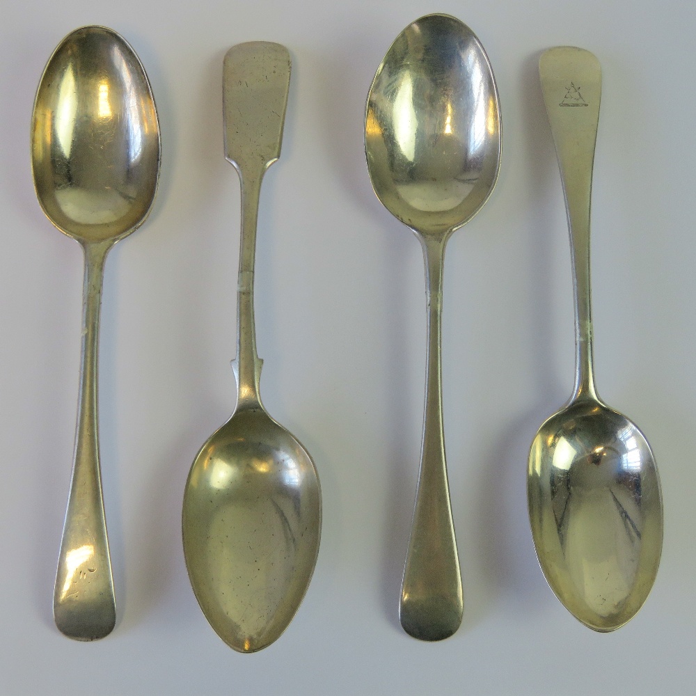 Four HM silver table spoons, two hallmarked London 1905, one London 1918, and one Sheffield 1918.