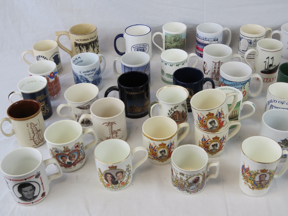 A selection of commemorative and souvenir ceramic mugs.