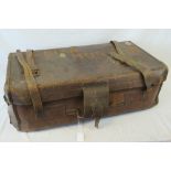 A vintage large leather suitcase with carrying handles, 87cm.