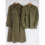 A WWII British Artillery Officers tunic with belt and private purchase double breasted overcoat,