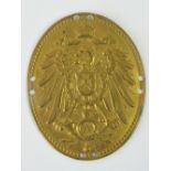 An Imperial German Army brass shield badge of ovel form, 6 x 5cm.