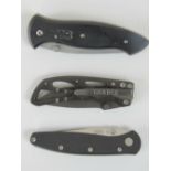 Two Gerber folding knives, together with a Winchester folding first production run knife.