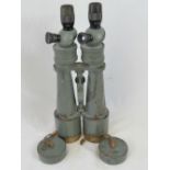 A pair of WWII German Kriegsmarine bridge binoculars, model M1359, made by Emil Busch,