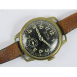 A 'Services Competitor' Officers trench watch having black dial with painted hands and numbers,