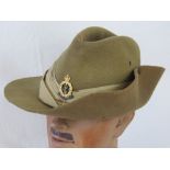 A green felt Tropical Royal Army Medical Corps hat with gilt brass cap badge, size 6 3/4,