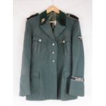 A WWII German SS Officers tunic with collar boards and Deutschland cuff title,