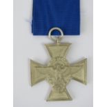 A WWII German Police medal with blue ribbon in presentation box.