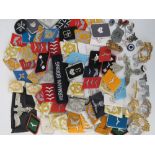 A quantity of assorted reproduction German badges and insignia including; Luftwaffe, SS and Panzer.