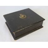 A wooden cigar box having brass Royal Marine insignia to lid,