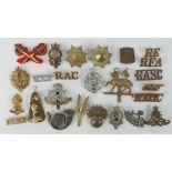 A quantity of assorted military badges including; RAOC, RFA, Durham, South Staffordshire cap badge,