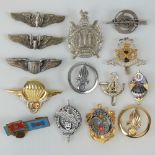 A quantity of assorted military badges including; North Stafford cap badge,