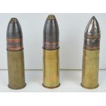 Three inert WWI 37mm Pom Pom cannon rounds, dated 1916, 1917 and 1918 respectively,