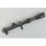 A c1950s German 2 1/2 x 18 Geco scope on claw mounts.