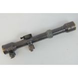 A German WWI period Hensoldt scope on claw mounts, x4 magnification.