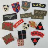 Eighteen assorted cloth military badges including; RAOC, Canada, RASC, etc.
