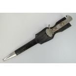 A rare German Police bayonet with silvered clam shell and having large eagle head upon,