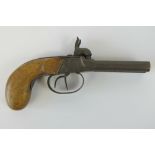 An antique double barrelled .44 calibre percussion pistol with working action.
