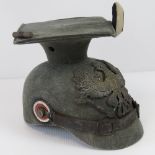 A WWI German Uhlans cavalry helmet dated 1915 with issue stamps,