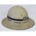 Of Northamptonshire interest; a WWII metal fire guards helmet,