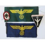 Two reproduction WWII German cloth badges having eagle and swastika in yellow thread,
