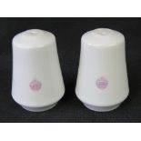 A pair of ceramic salt and pepper cellar