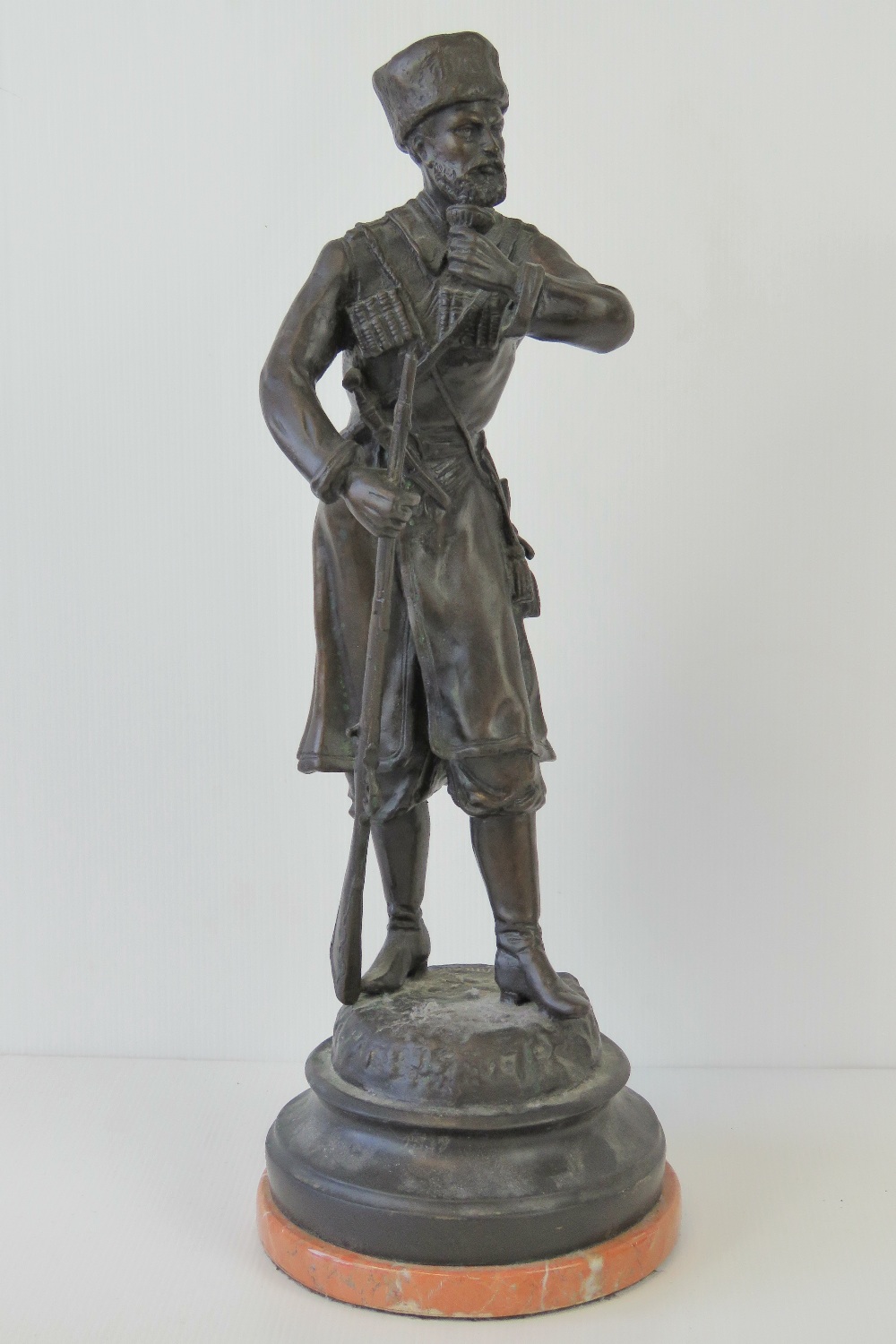 A 19thC bronze sculpture of a Cossack so