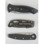 Two Gerber folding knives, together with