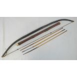 An ethnic tribal wood self bow with gut