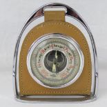 A vintage Shortland Smiths barometer mounted in leather and hanging from stirrup frame,