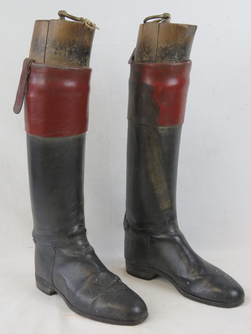 A pair of vintage gentleman's black and tan leather riding boots,
