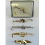 A Stratton tie or stock clip in the form of a riding crop and horse head in presentation Stratton