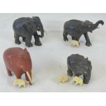 Three carved ebony elephants, together w