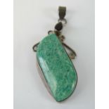 A silver and hardstone pendant having te