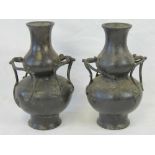 A fine heavy pair of bronze Oriental vas