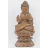 A 20th century carved hardwood Buddha fi