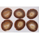 A set of six polished banded agate place