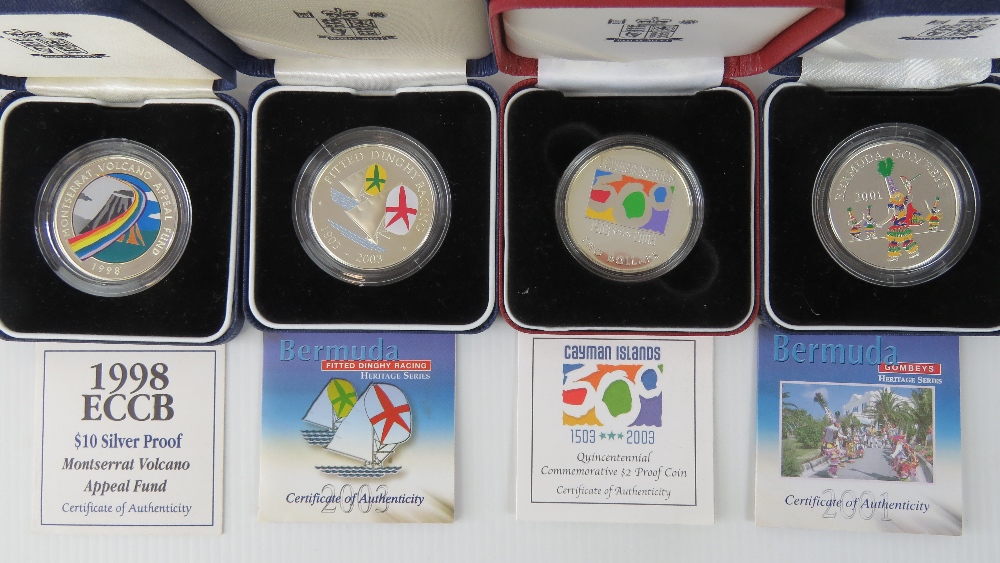 Four silver commemorative coins, mint in