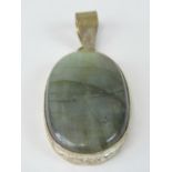 A large oval agate cabachon in floral mount, 6.5cm in length.