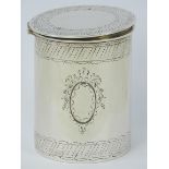 A silver dressing table pot having hinged lid and fine engraved pattern upon,