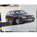 A collection of Renault, VW, Honda, BMW, Ford and Subaru advertising pamphlets,