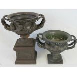 An antique cast iron urn of Classical fo