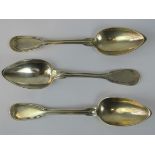 Three silver serving spoons marked Bunet