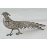 A mid 20thC cast white metal model of a golden pheasant in a standing pose, 27cm long.