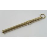 A 9ct gold propelling toothpick having chatelaine loop, hallmarked Birmingham 375.