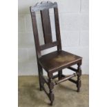 A single Victorian stained oak solid seat hall chair.