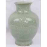 A Republican Chinese celadon green ovoid vase with foliate scrolls, flower heads and lappet border,