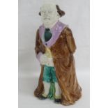 A Victorian Majolica figural jug in the form of a gentleman (possibly William Gladstone) in a