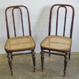 A pair of cane seated bentwood chairs in good order.